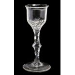 A late 18th Century slender wine glass, cut bowl and a facet cut stem,