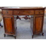 A 19th Century mahogany bow fronted kneehole desk, having three drawers and two doors,