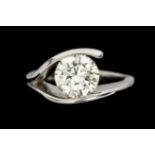 A diamond solitaire, cross over platinum ring, the brilliant cut diamond weighing approx 1.