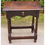 A Queen Anne joined oak side table, fitted with a single drawer, raised on turned legs,