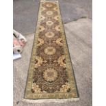 A Karaja style runner, green and beige ground,