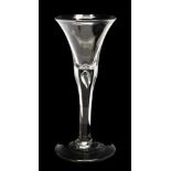 A late 18th Century trumpet shaped wine glass with a tear drop air bubble,