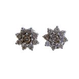 A pair of diamond flowerhead cluster white gold stud earrings,