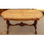 A mid Victorian walnut quarter veneered twin pedestal centre table,