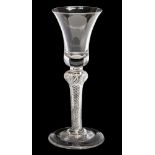 A mid 18th Century wine glass, having a trumpet shaped bowl, knopped stem, with spiral air twist,