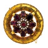 A Victorian gold and paste circular brooch,