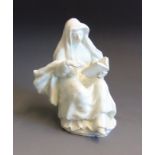 An English porcelain blanc de chine figure of a nun, circa 1760, height 16.