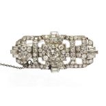 An Art Deco diamond and platinum brooch, geometric design, comprising claw,