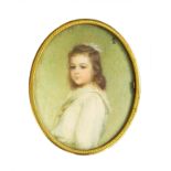 An Edwardian oval portrait miniature of a girl wearing a white dress,