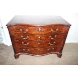 A George III and later mahogany chest of drawers, of serpentine form,