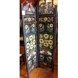 An Indian four panel metal screen, purchased in South Africa, decorated with sunflowers, elephants,