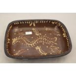 An 18th Century rectangular Slipware dish, with foliate decoration,