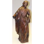 Religious interest, a carved oak figure depicting a robed gentlemen clutching a book,