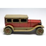 A 1920's tinplate chauffeur driven saloon,