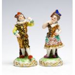 A pair of late 19th Century Sampson figurines of a columbine and companion, pseudo Derby puce marks,