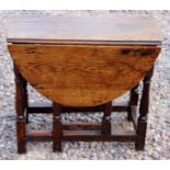 A very small oak gate leg table with beech stretchers of George I period circa 1720,