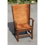 An Arts & Crafts oak Orkney armchair in the manner of Liberty & Co, early 20th Century,