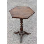 A 17th Century or later oak hexagonal pedestal candle stand,