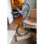 A 1920s Period 'gandi' welded and applied iron architectural dragon sculpture.