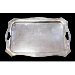 A George V large silver tray with intregal handles, engraved and chased with a border,