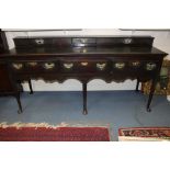 An 18th Century oak dresser base, the top with three spice drawers,