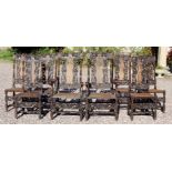 A set of eight Victorian Carolean style oak carved dining chairs,