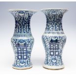 A pair of Chinese blue and white yen yen vases, 19th Century, the necks with shou characters,