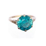 An Art Deco blue zircon solitaire ring, the large round mixed cut blue zircon approx 10mm diameter,