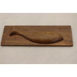 A rectangular wooden plaque, applied with carved fish, possibly Pitcairn Islands, approx 34.