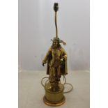 An early 20th Century gilt metal electric table lamp, in the form of a cavalier,