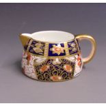 A Davenport 'Ships' cream jug, pattern No.2614, imari style, circa 1870-86, 10cm diameter, 4.