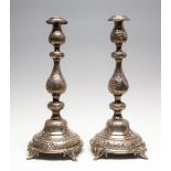 A pair of Edwardian silver candlesticks,