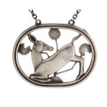 Georg Jensen, a Danish Modernist silver pendant, Kneeling Deer, approx 4.
