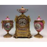 A 19th Century French ormolu bracket clock garniture, circa 1870, of Baroque design,