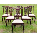 A set of six Irish mid 18th Century mahogany dining chairs with cabriole legs terminating in trefid