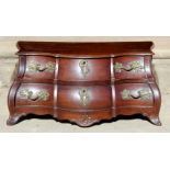 A mid 18th Century miniature/apprentice piece Dutch bombe shaped commode,