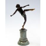 A 1930's Art Deco bronze study of a female ballet dancer wearing a green dress,