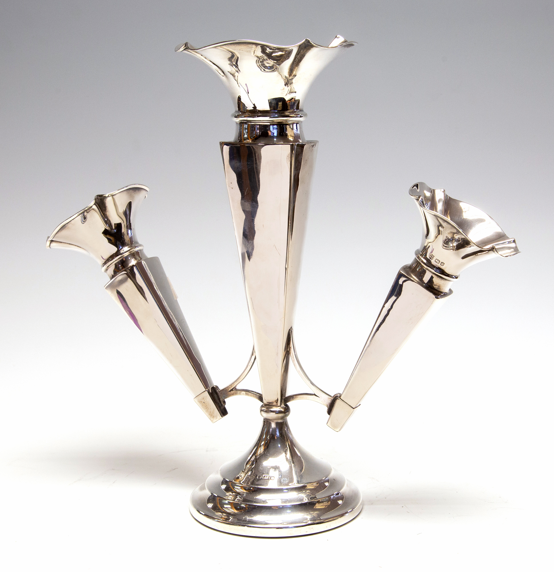 A George V silver epergne, trumpet shaped central vase stem flanked by two matching vases,