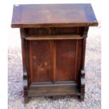 A large early 19th Century 'Georgian' oak lectern with turned column supports and sloping book rest