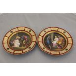 A pair of 19th Century Vienna cabinet plates, hand painted, one depicting a couple and a painter,