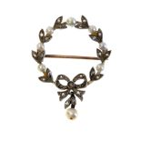 A late Victorian diamond and pearl set garland style circular drop brooch,