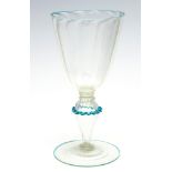 A Venetian clear glass goblet, ribbed conical bowl, blue pincered knopped stem, broken pontil,