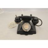 A 1930's Art Deco 200 series black bakelite desk telephone, the handset dated 1935,