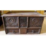 A 17th Century oak table top mule chest, hinged plank cover,