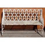A mid Victorian cast iron white painted garden bench, Gothic back and pierced seat approx 90cm high,