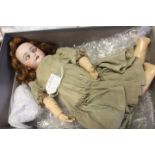 Doll: A bisque head doll, open and close eyes, open mouth revealing four top teeth,