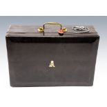 A George V black leather despatch box, gilt tooled Royal cypher to the cover, maker John Peck & Son,