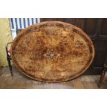 A mid Victorian walnut and marquetry veneered tilting loo table top, 55cm high, 135cm long,