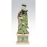 A Chinese glazed biscuit figure of an immortal, 19th Century,