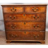 A George III oak chest of drawers, having two short over three long graduated drawers, 93cm high,